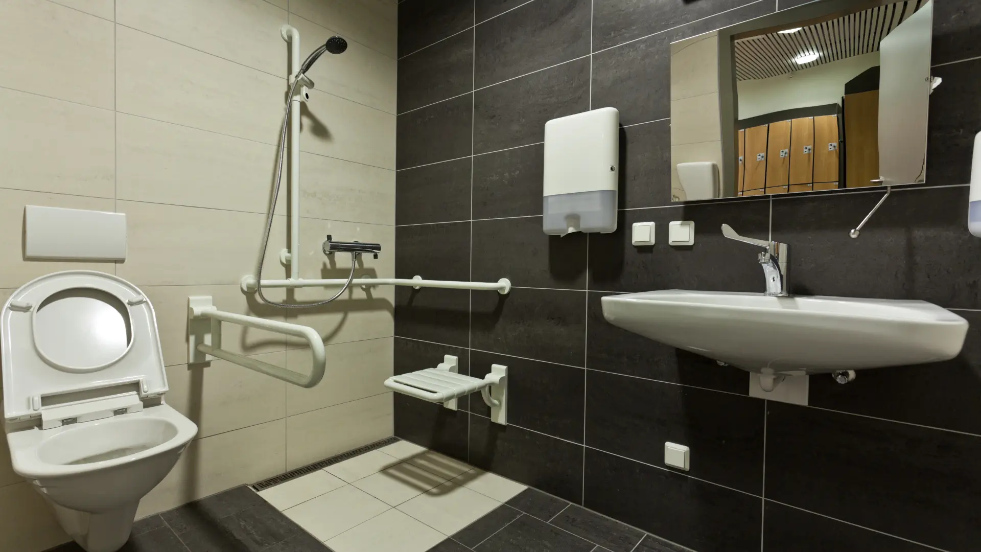 Accessible wet room with level-access shower, grab rail and fold-down shower seat