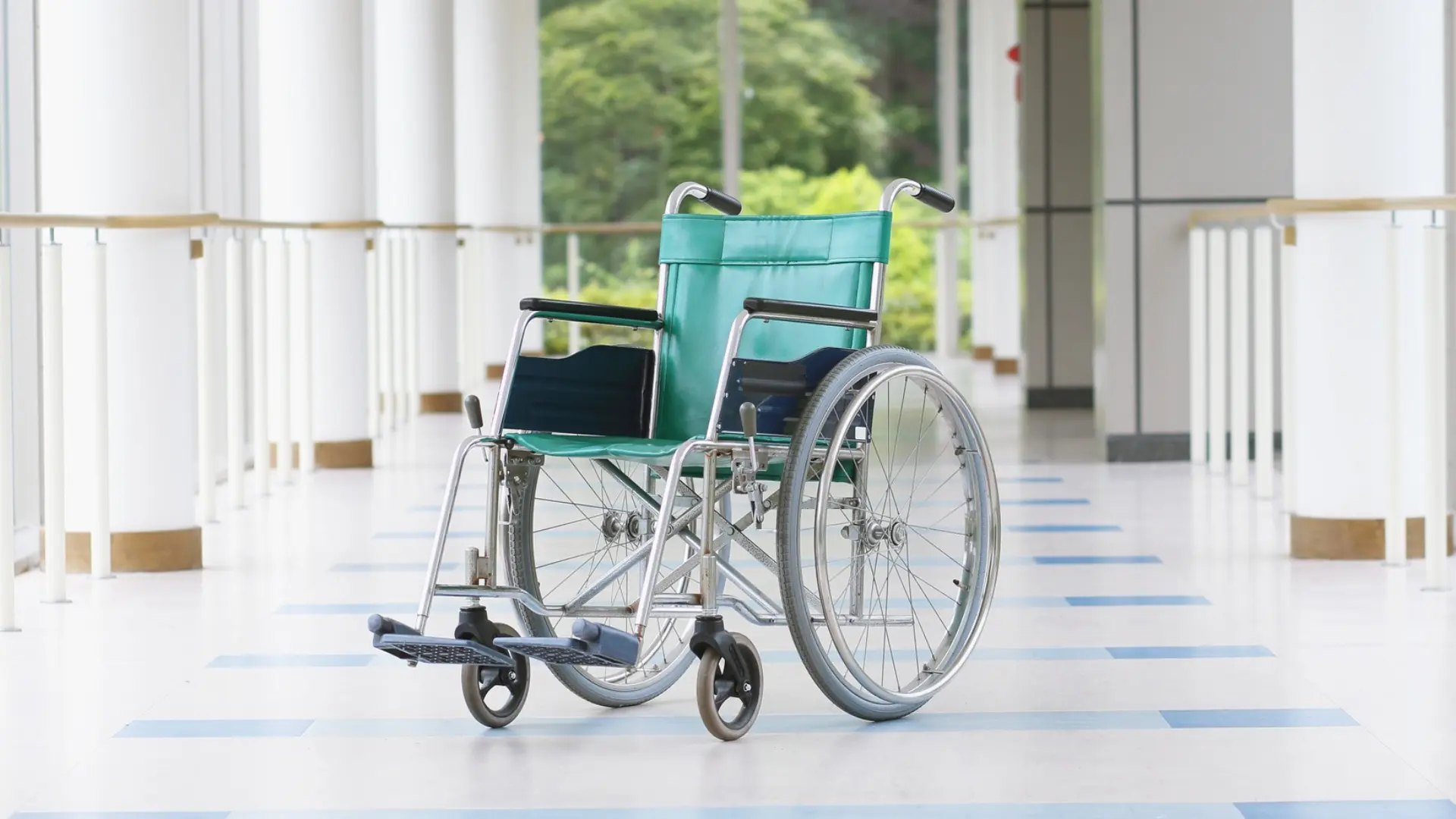 Wide, step-free corridor with handrails to both sides and slip-resistant flooring