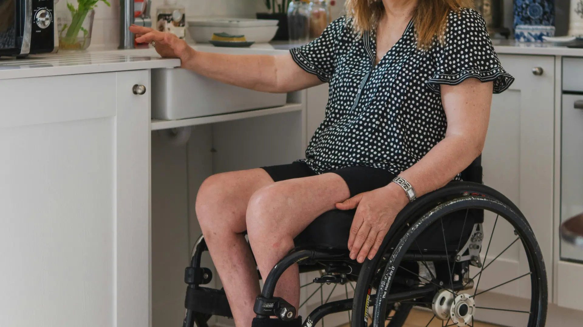 Accessible kitchen with lowered worktop and clear knee space beneath the sink