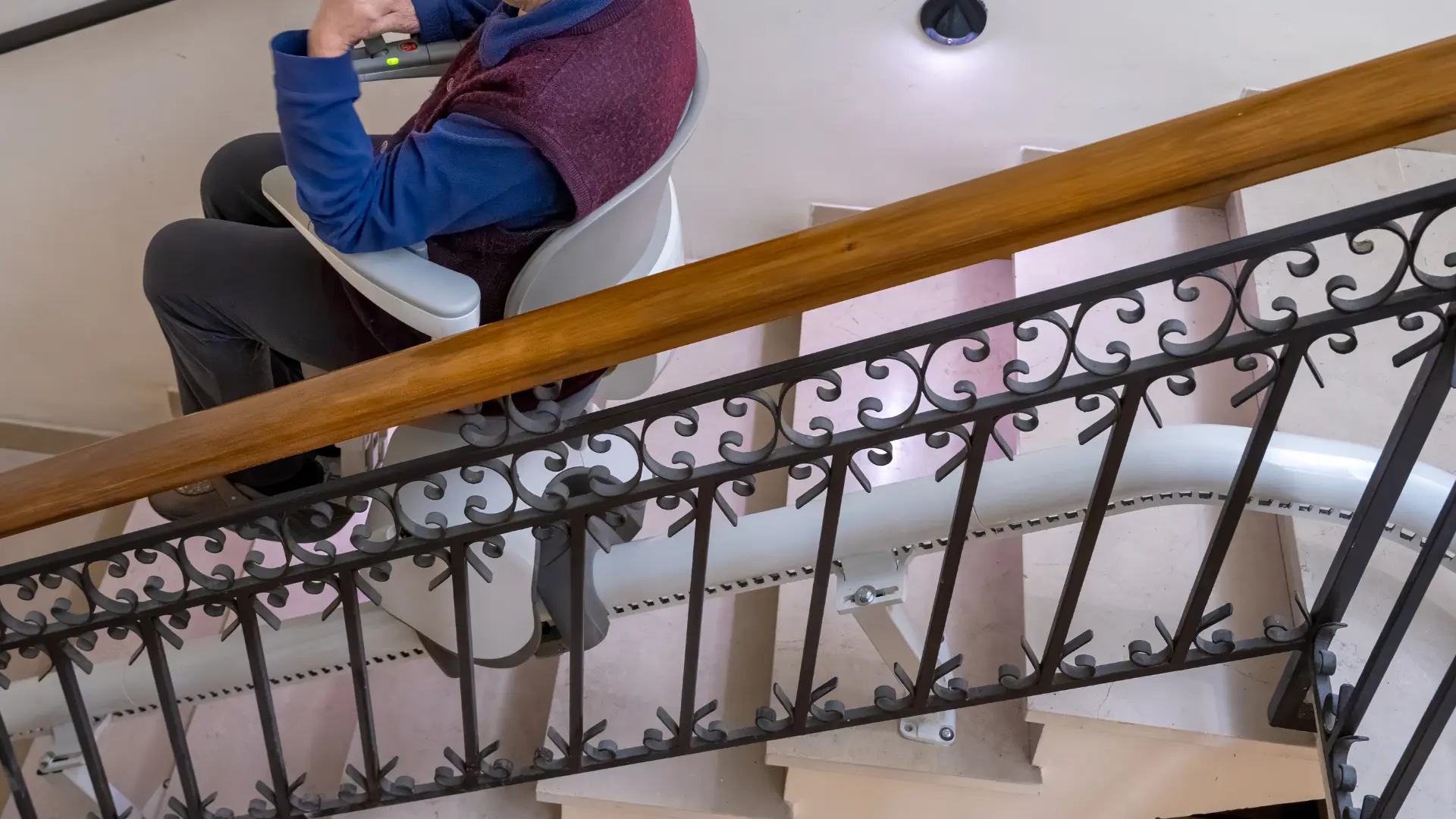 Stairlift fitted to the treads of a domestic staircase